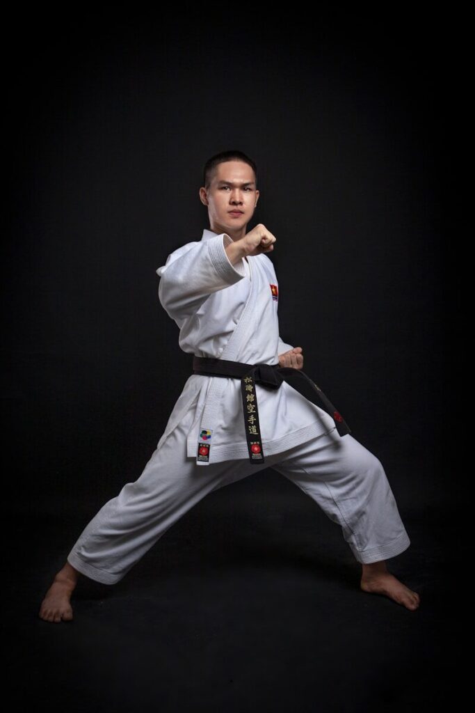 a man in a karate uniform